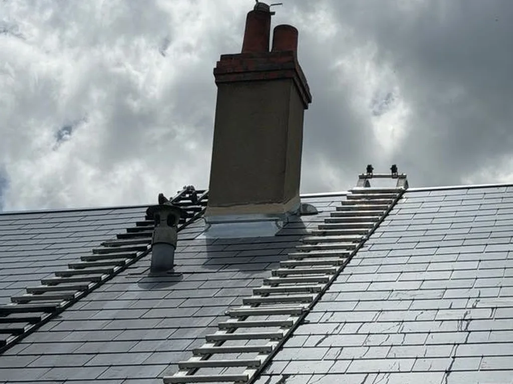 Abergement de cheminée en zinc façonné par Maison Dallau près d’Auneau